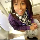 A black girl is seen sitting on a toilet taking a dump while having a weird dialogue with her friend filming her. We get to see her strain and clearly hear the plop!